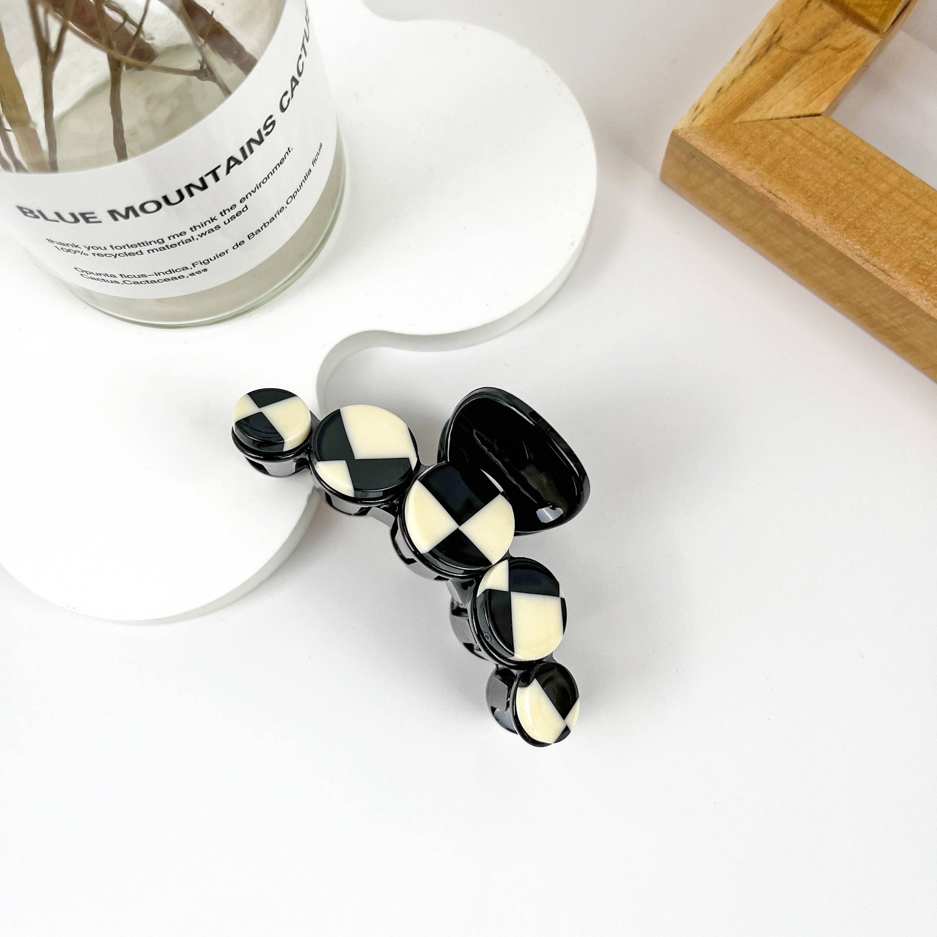 Simple black and white checkerboard hair clip