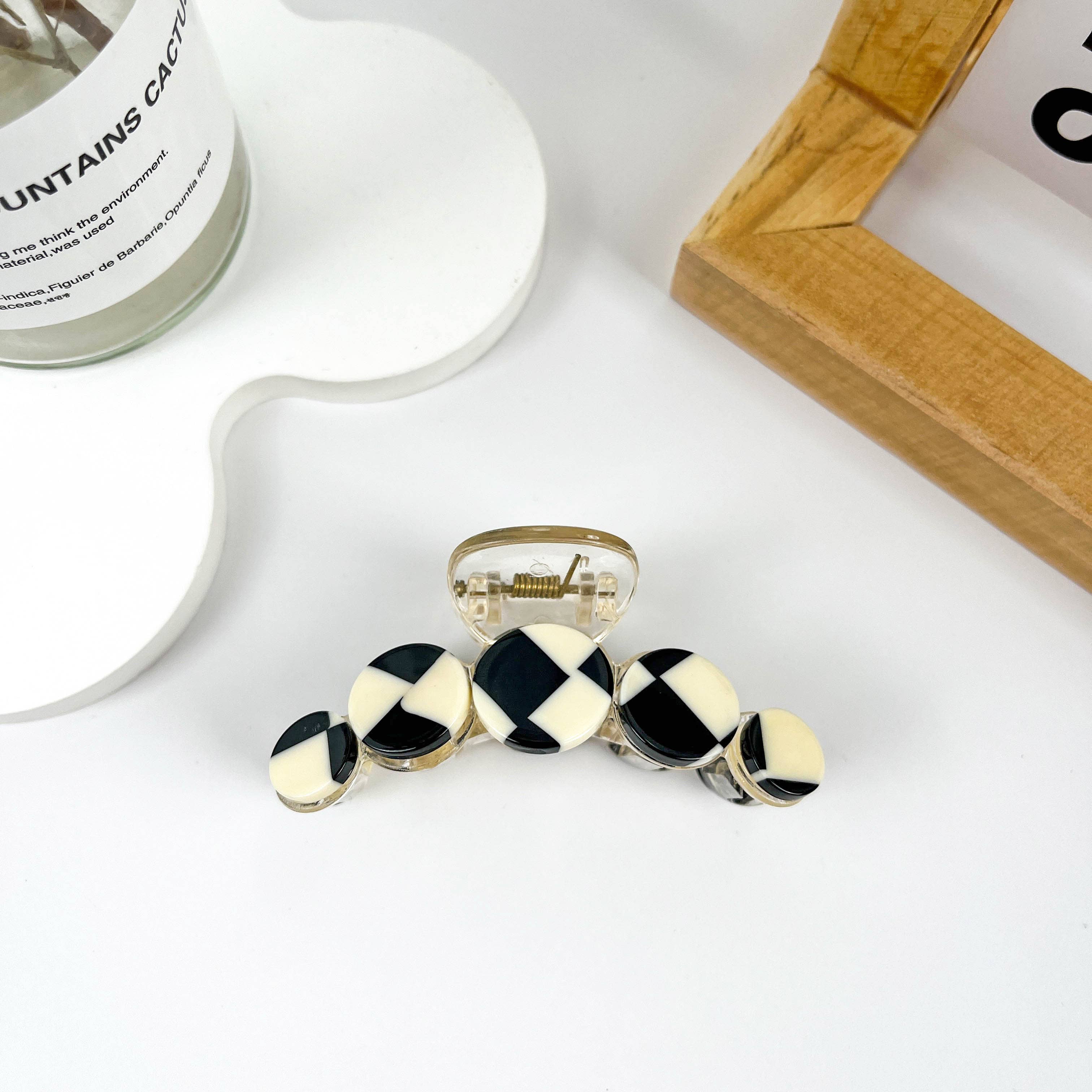 Simple black and white checkerboard hair clip