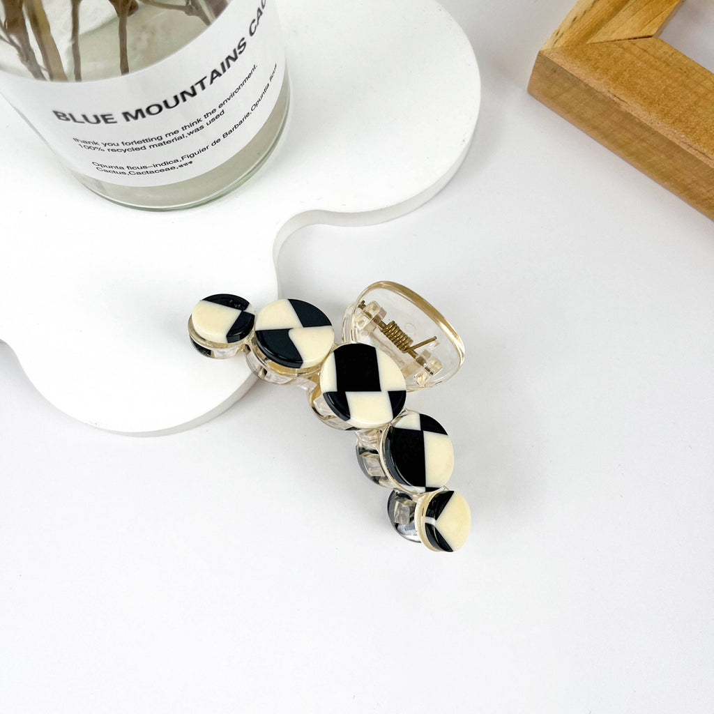 Simple black and white checkerboard hair clip