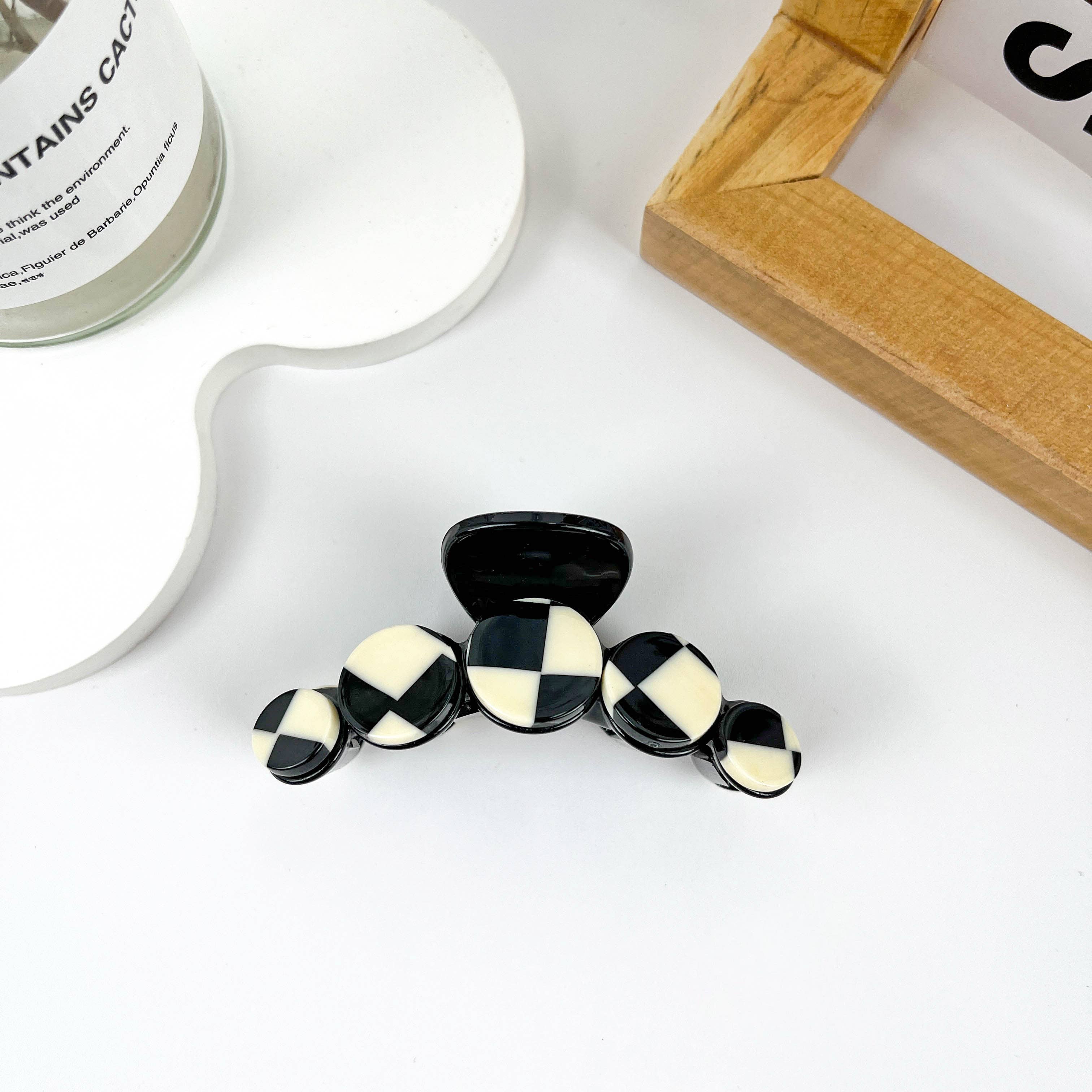 Simple black and white checkerboard hair clip